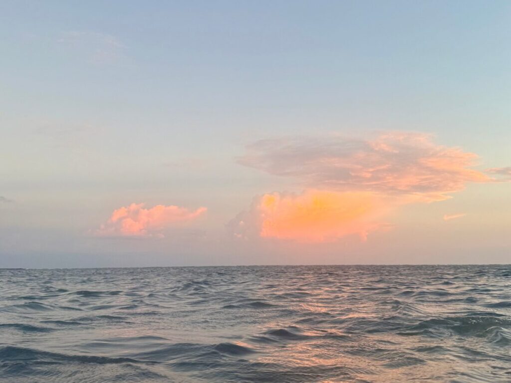 The clouds at sunset over water